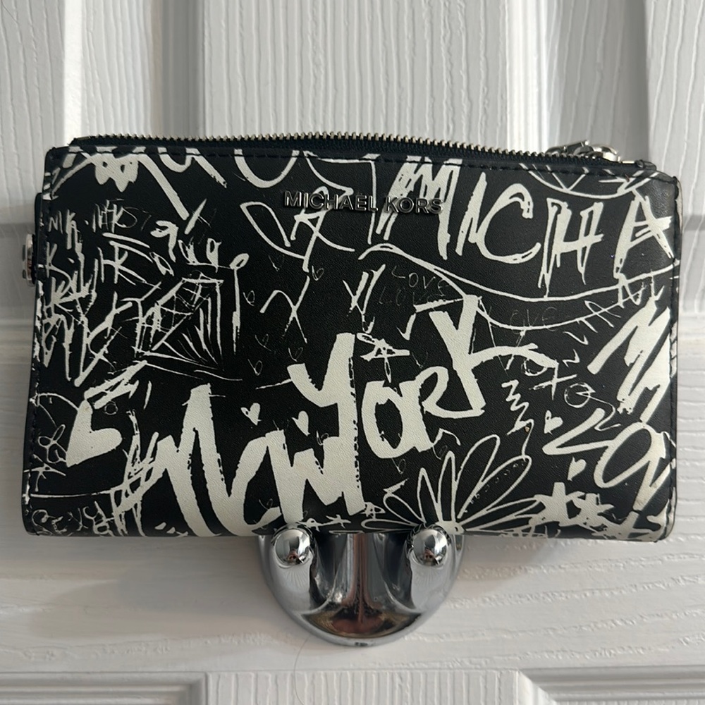Michael Kors graffiti jet set smartphone wallet.
